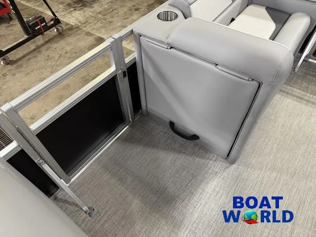 Slide: The Image of 2025 Tahoe Sport 23' Fish & Cruise interior with gray seating and cup holder. - 27