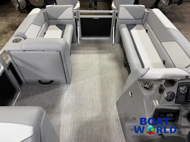 Slide: The Image of 2025 Tahoe Sport 23' Fish & Cruise interior with gray seating and modern dashboard. - 29