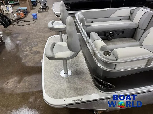 Slide: The Image of 2025 Tahoe Sport 23' Fish & Cruise boat interior with seating and cup holders. - 3