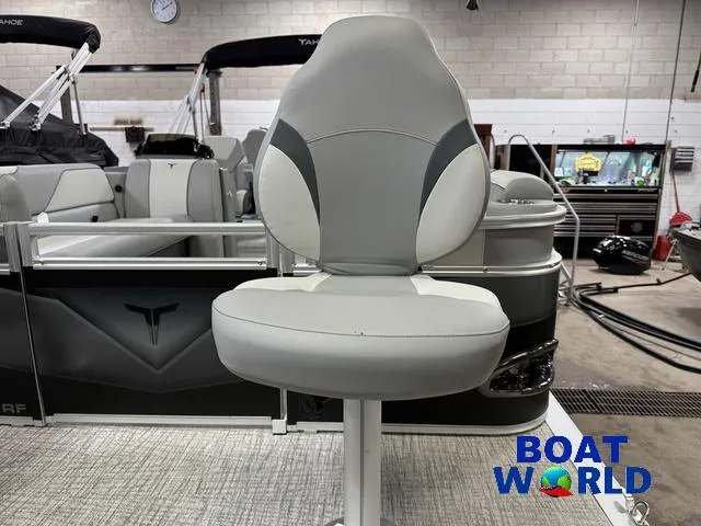 Slide: The Image of 2025 Tahoe Sport 23' Fish & Cruise boat seat in showroom, featuring Honda 4-Stroke EFI. - 34