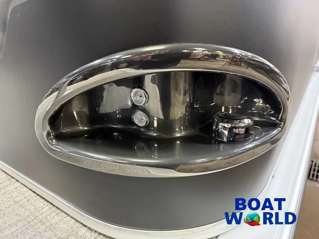 Slide: The Image of 2025 Tahoe Sport 23' Fish & Cruise boat detail with chrome accents. - 35