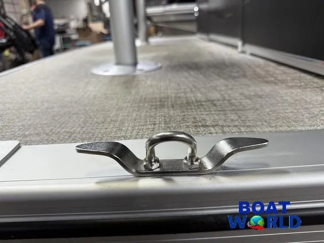 Slide: The Image of 2025 Tahoe Sport 23' Fish & Cruise boat deck detail with cleat, Boat World logo. - 36