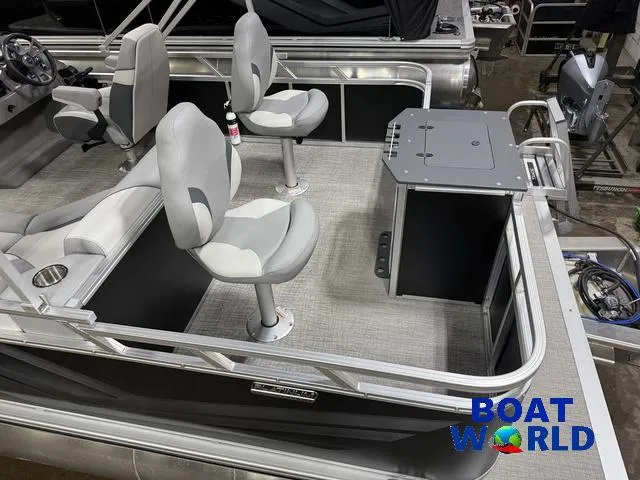 Slide: The Image of 2025 Tahoe Sport 23' Fish & Cruise boat interior with seating and console. - 6