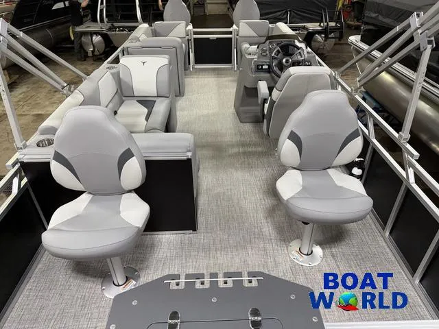 Slide: The Image of 2025 Tahoe Sport 23' Fish & Cruise boat interior with modern seating and steering console. - 7