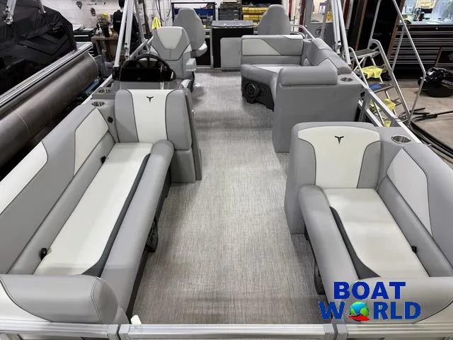 Slide: The Image of 2025 Tahoe Sport 23' Fish & Cruise boat interior with gray seating, showcased at Boat World. - 8