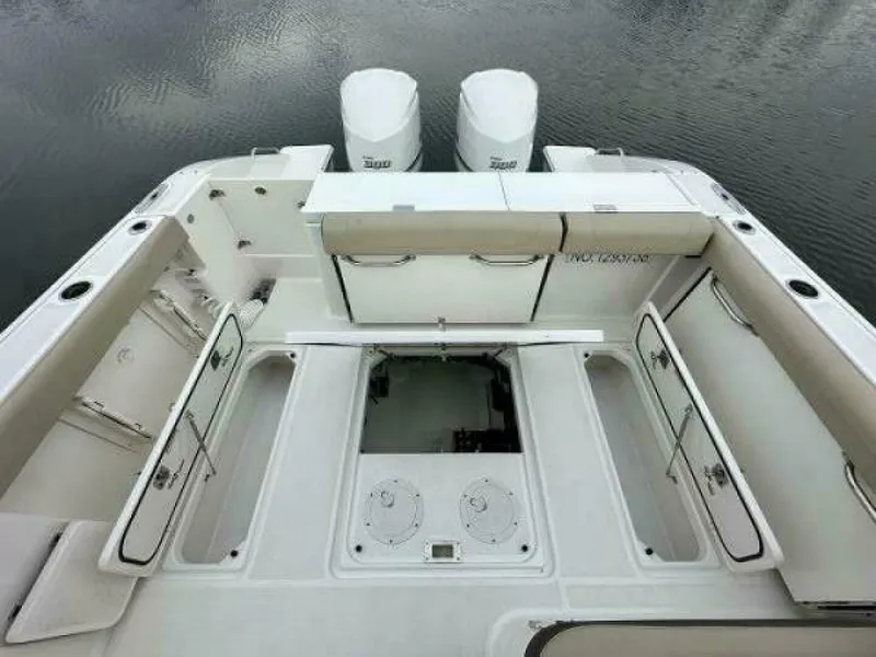 Slide: The Image of 2019 Pursuit DC 325 Dual Console boat with spacious deck and twin engines. - 25