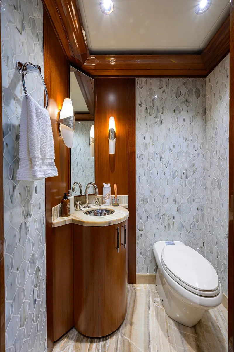Slide: The Image of Luxurious bathroom in 2020 Westport Motor Yacht with elegant wood and marble finishes. - 10