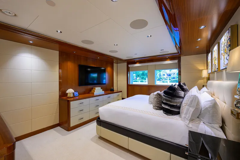 Slide: The Image of Luxurious bedroom interior in 2020 Westport Motor Yacht, featuring elegant decor and modern amenities. - 13