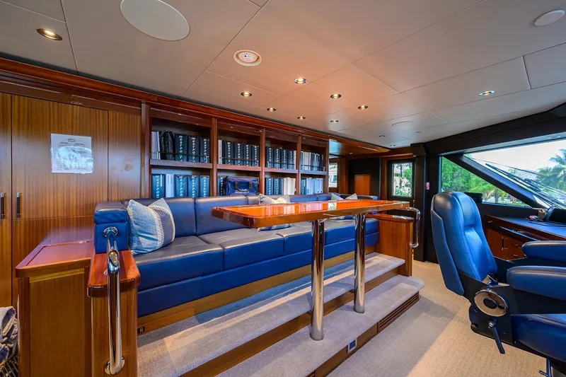 Slide: The Image of Luxurious interior of 2020 Westport Motor Yacht with plush seating and elegant wood finishes. - 30