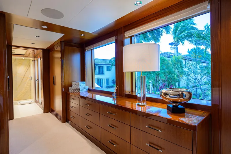 Slide: The Image of Luxurious interior of 2020 Westport Motor Yacht with elegant wood cabinetry and large windows. - 33