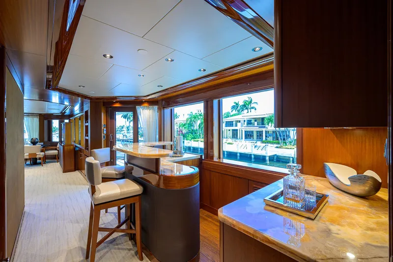 Slide: The Image of Luxurious interior of 2020 Westport Motor Yacht with elegant bar and waterfront view. - 36