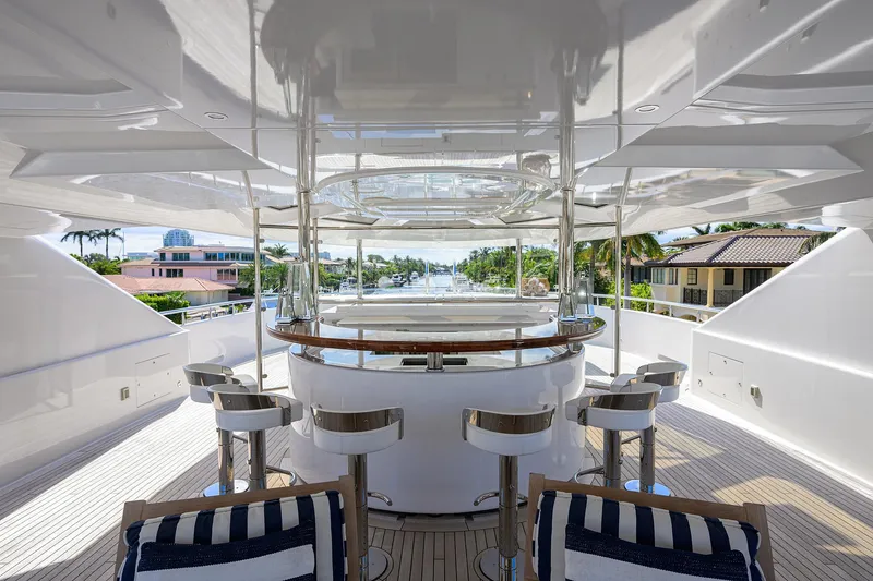 Slide: The Image of Luxurious 2020 Westport Motor Yacht with elegant outdoor bar and seating area. - 48