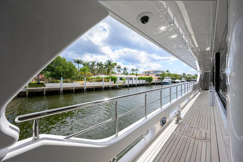 Slide: The Image of 2020 Westport Motor Yacht deck with waterfront view and palm trees. - 5