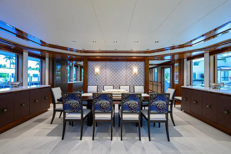 Slide: The Image of Luxurious dining area on 2020 Westport Motor Yacht with elegant decor and seating. - 8