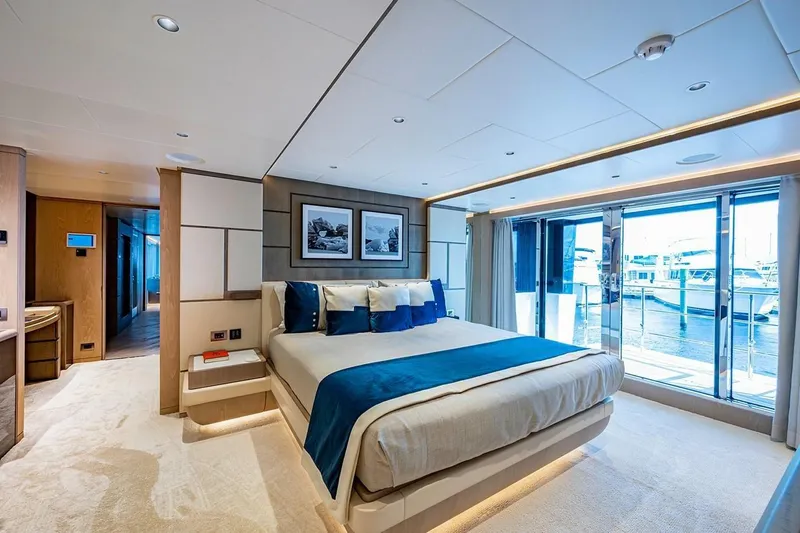 Slide: The Image of Luxurious bedroom interior of 2020 Majesty motor yacht with modern decor and marina view. - 12