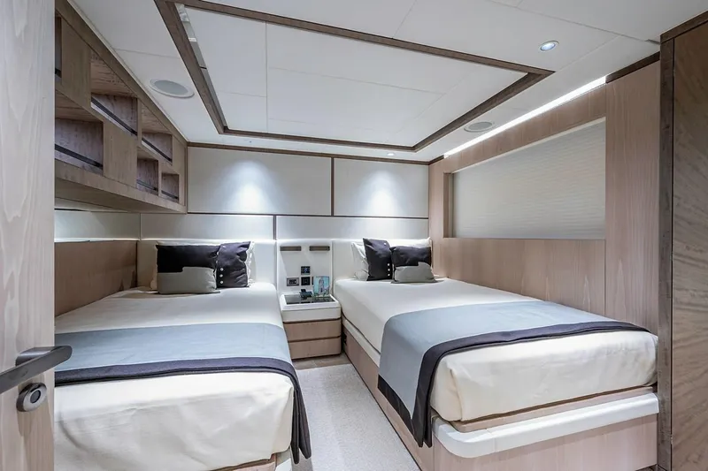 Slide: The Image of Luxurious twin bedroom in 2020 Majesty motor yacht, featuring modern design and elegant furnishings. - 22
