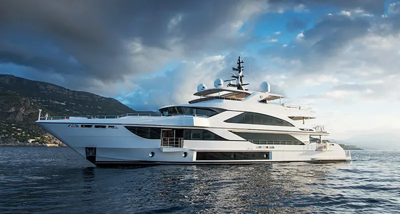 Slide: The Image of Majesty motor yacht 2020 cruising on serene waters under a cloudy sky. - 45