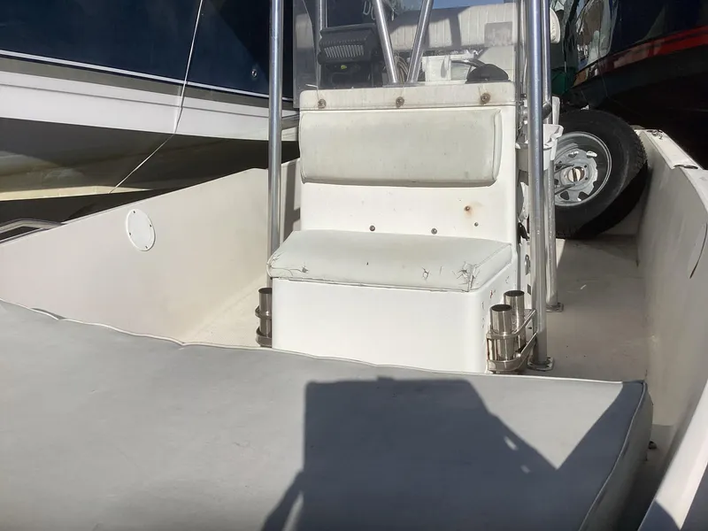 Slide: The Image of 2002 Key West 1720 boat interior with seating and console. - 12