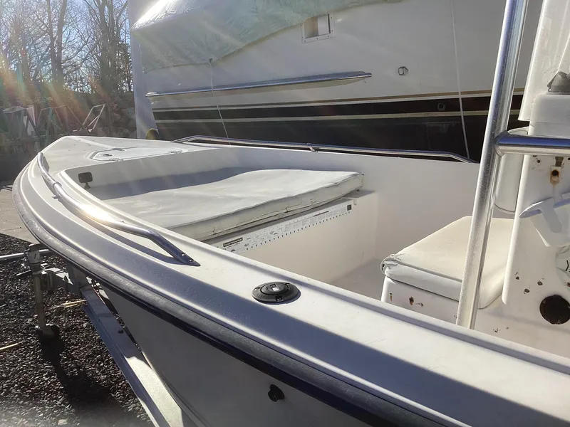 Slide: The Image of 2002 Key West 1720 boat, white interior, docked outdoors in sunlight. - 15