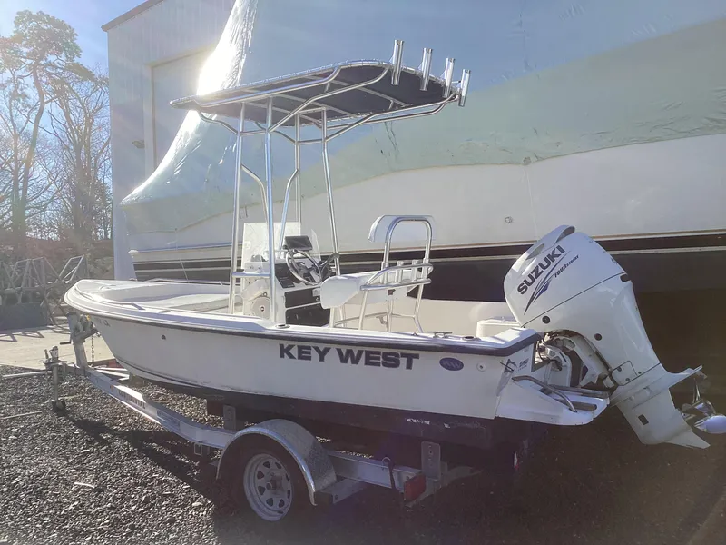 Slide: The Image of 2002 Key West 1720 boat with Suzuki outboard motor on trailer. - 2
