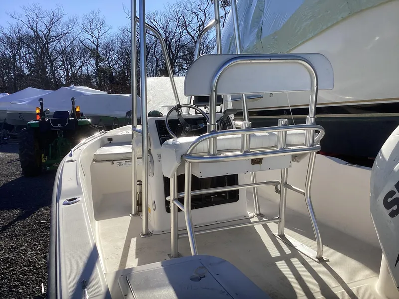 Slide: The Image of 2002 Key West 1720 boat interior with steering console and seating. - 3