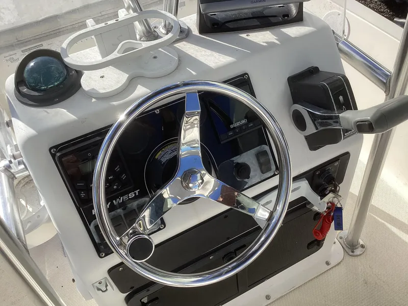 Slide: The Image of Steering console of a 2002 Key West 1720 boat with chrome wheel and controls. - 7