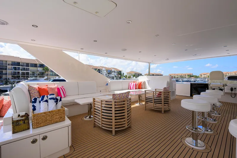 Slide: The Image of Luxurious 2020 Hargrave Motor Yacht deck with elegant seating and scenic marina view. - 35