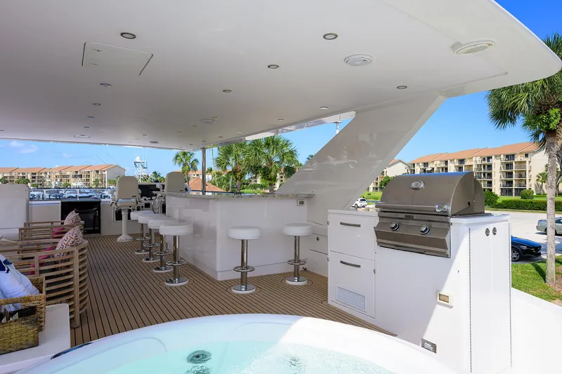 Slide: The Image of Luxurious 2020 Hargrave Motor Yacht deck with bar, seating, and grill. - 39