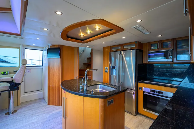 Slide: The Image of Luxurious 2008 Lazzara Motor Yacht kitchen with modern appliances and sleek design. - 11