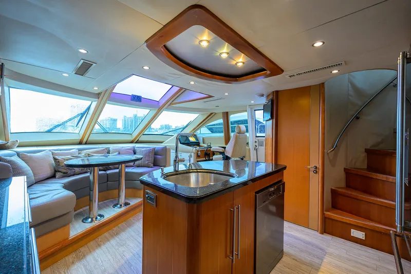 Slide: The Image of Luxurious interior of a 2008 Lazzara Motor Yacht with modern kitchen and seating area. - 12