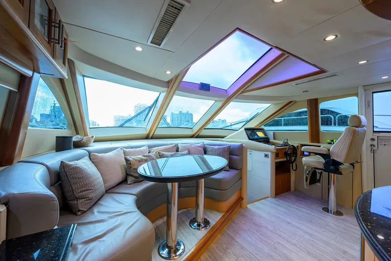 Slide: The Image of Luxurious 2008 Lazzara Motor Yacht interior with plush seating and panoramic windows. - 13