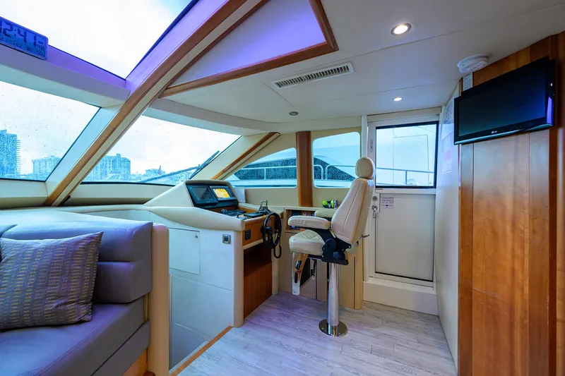 Slide: The Image of Luxurious 2008 Lazzara Motor Yacht interior with helm station and plush seating. - 14