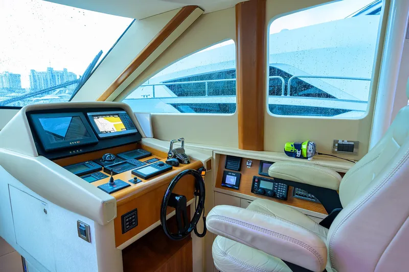 Slide: The Image of Helm of 2008 Lazzara Motor Yacht with modern navigation equipment and luxurious seating. - 15