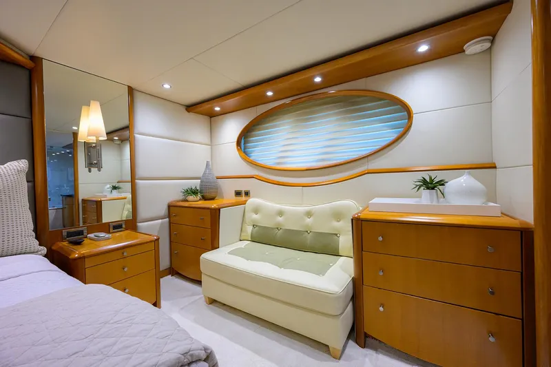 Slide: The Image of Luxurious 2008 Lazzara motor yacht interior with elegant wood furnishings and cozy seating. - 20