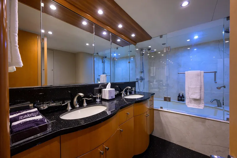 Slide: The Image of Luxurious bathroom in a 2008 Lazzara Motor Yacht with dual sinks and glass shower. - 21