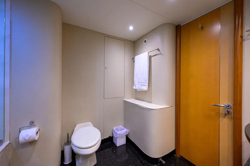 Slide: The Image of Bathroom interior of 2008 Lazzara Motor Yacht with modern fixtures and wooden door. - 22