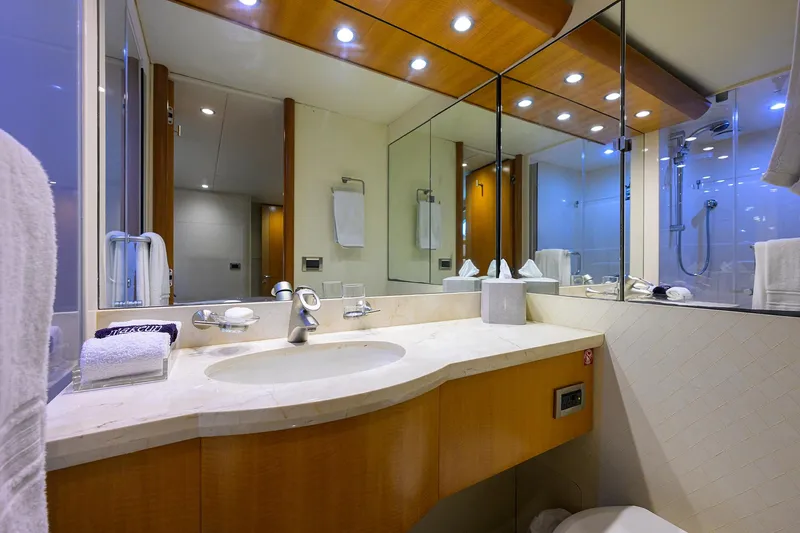 Slide: The Image of Luxurious bathroom in a 2008 Lazzara Motor Yacht with modern fixtures and elegant design. - 25