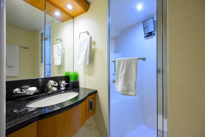 Slide: The Image of Luxurious bathroom in a 2008 Lazzara Motor Yacht with modern fixtures and elegant design. - 31