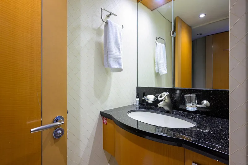 Slide: The Image of Luxurious bathroom in a 2008 Lazzara Motor Yacht with modern fixtures and elegant design. - 34
