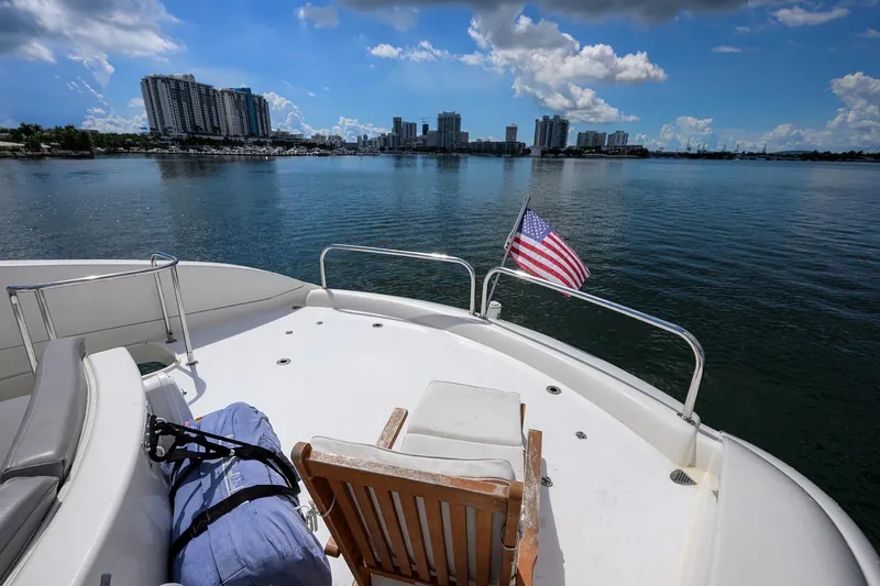 Slide: The Image of 2008 Lazzara Motor Yacht deck with city skyline and American flag. - 36