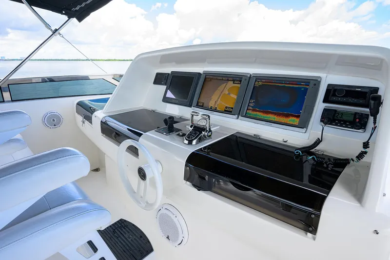 Slide: The Image of 2008 Lazzara Motor Yacht helm with advanced navigation systems and luxurious seating. - 43