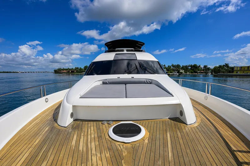 Slide: The Image of 2008 Lazzara Motor Yacht on serene water, showcasing sleek design and spacious deck. - 47