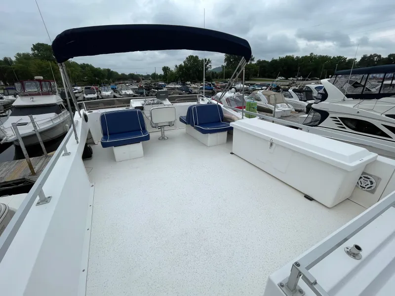Slide: The Image of Spacious deck of 2003 Gibson 50 Classic boat with seating and canopy. - 11