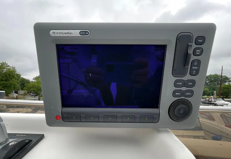 Slide: The Image of Close-up of a Raymarine GPS display on a 2003 Gibson 50 Classic boat. - 18