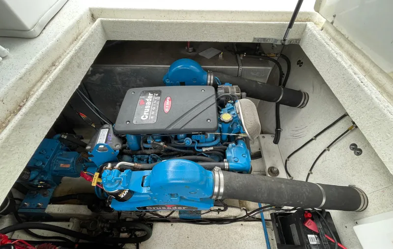 Slide: The Image of 2003 Gibson 50 Classic engine compartment with blue marine engine components. - 20