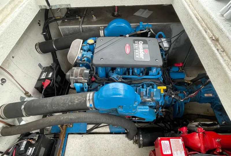 Slide: The Image of 2003 Gibson 50 Classic engine compartment with blue marine engine and components. - 21