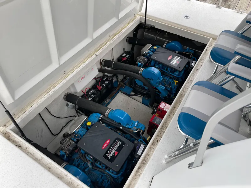Slide: The Image of Engine compartment of a 2003 Gibson 50 Classic boat, featuring dual engines. - 22