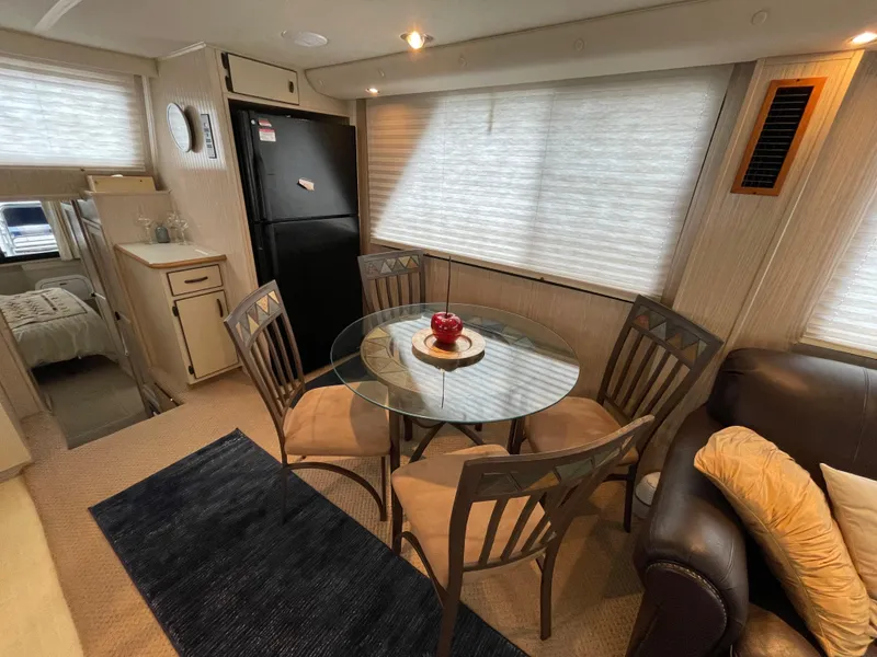 Slide: The Image of Interior of a 2003 Gibson 50 Classic boat with dining area and modern furnishings. - 27