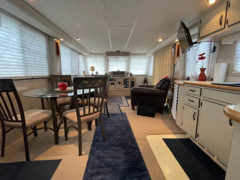 Slide: The Image of Luxurious interior of a 2003 Gibson 50 Classic yacht with dining area and lounge. - 28