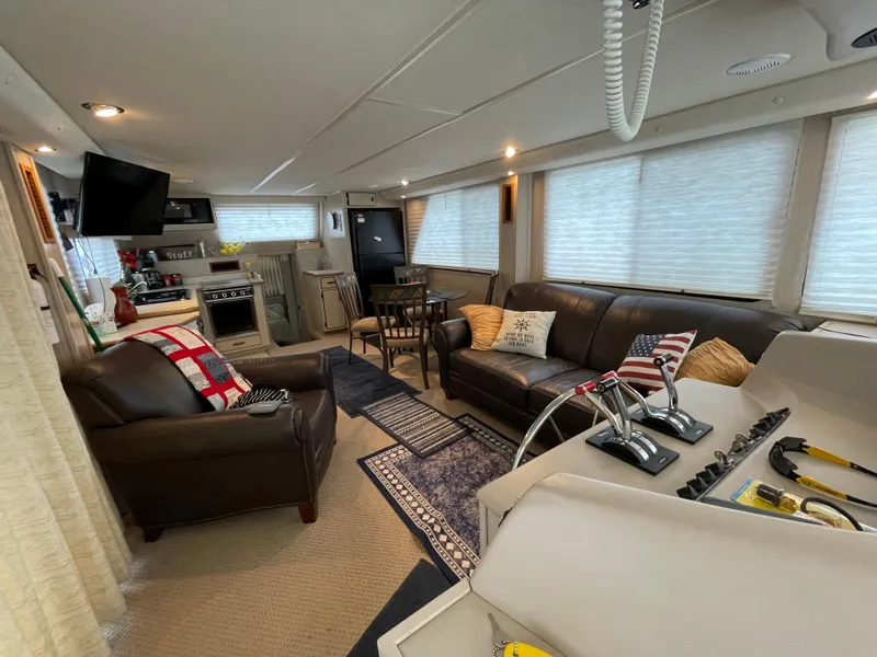 Slide: The Image of Interior of a 2003 Gibson 50 Classic yacht with cozy seating and modern amenities. - 29